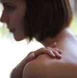 woman smelling oils